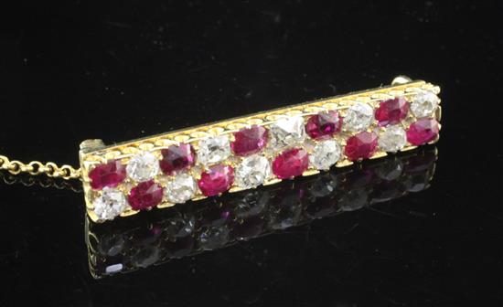 A 1940s/1950s gold, ruby and diamond bar brooch, 1.25in.